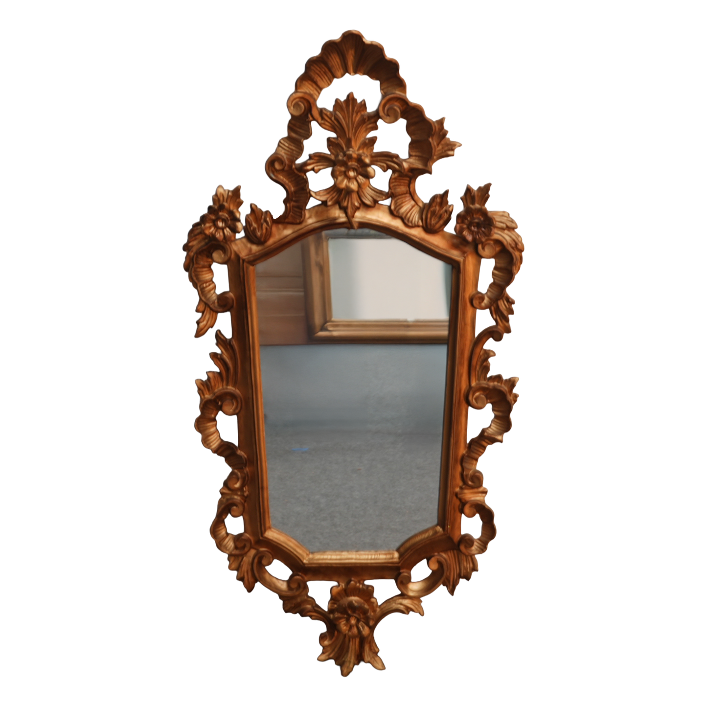 Decorative wooden mirror with intricate carvings on a white background