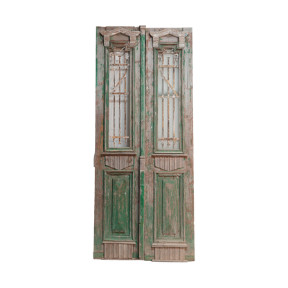 Pair of vintage wooden doors with green accents on a white background