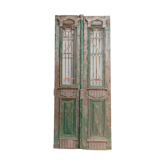 Pair of vintage wooden doors with green accents on a white background