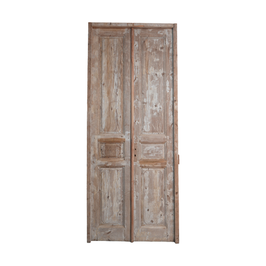 Pair of wooden doors with a weathered finish on a white background