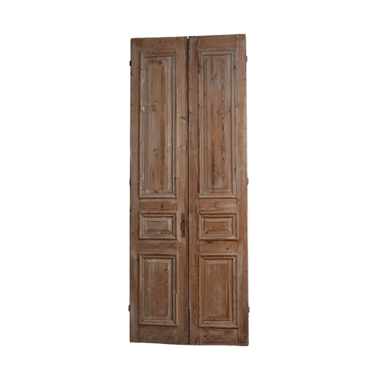 Pair of wooden doors with panel design on a white background
