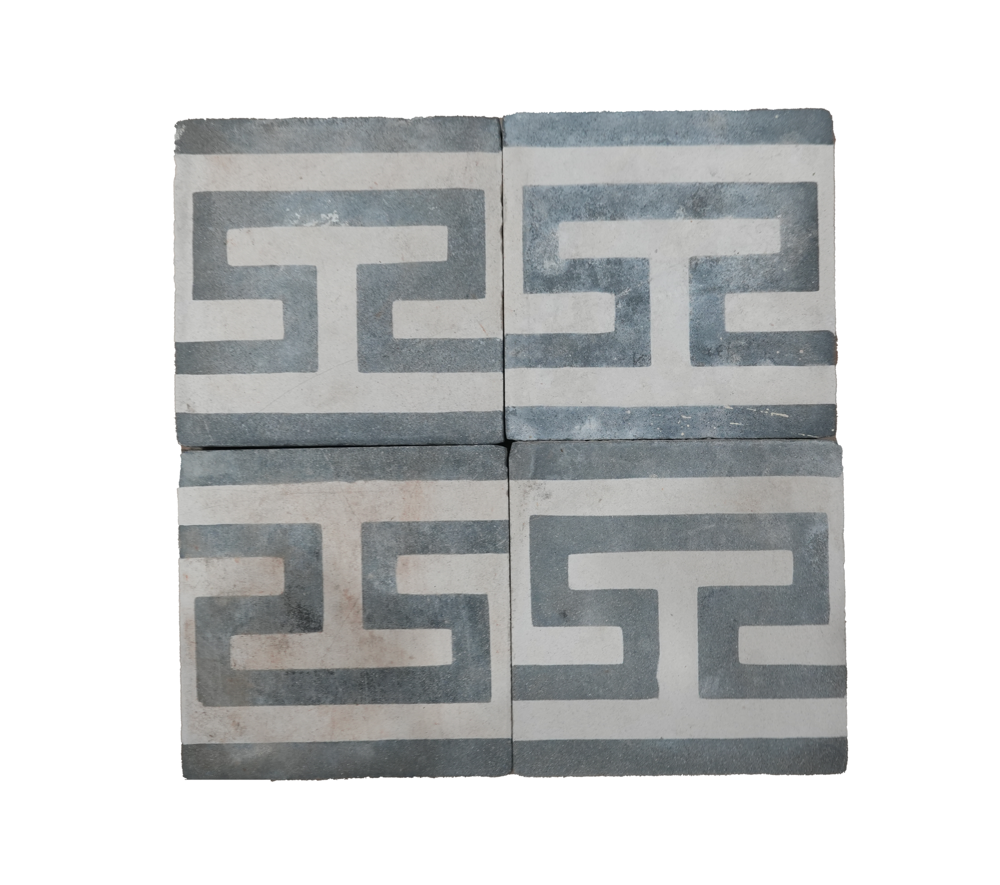 Two decorative tiles with Greek key pattern on a white background