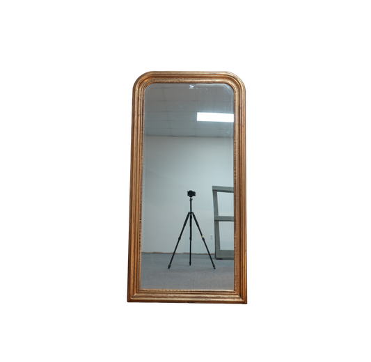 Wooden-framed mirror on a white background