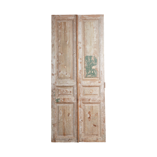 Pair of vintage wooden doors with a white background
